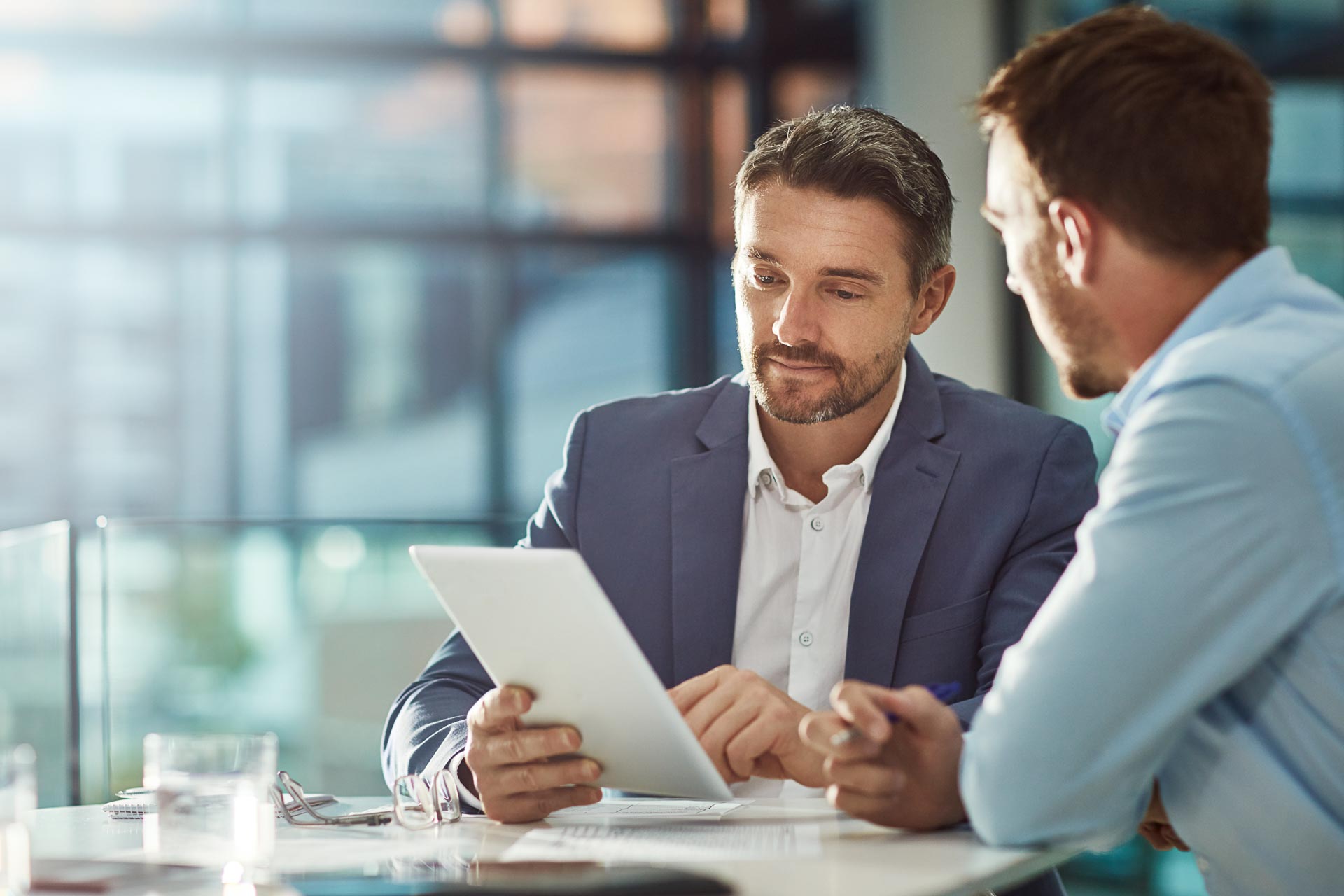 teamwork-meeting-tablet-business-people-office-workplace-collaboration-technology-workers-men-employees-with-touchscreen-planning-sales-research-financial-strategy-company